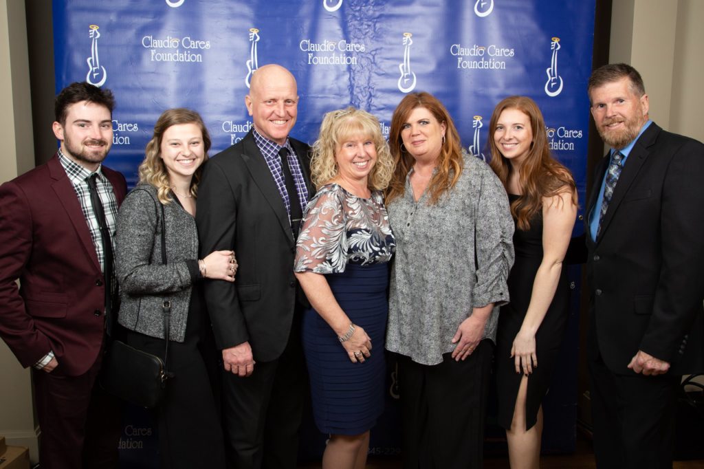 Heather owner in middle navy, husband Butch to left and daughter Sarah with friends and family. Photo: Varuzzo Photo